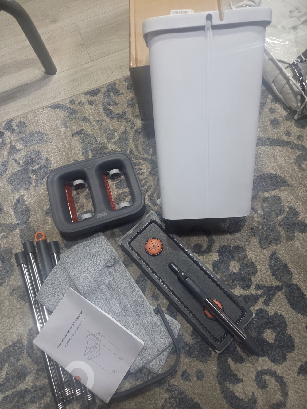 Gray and White Spray Mop Cleaning System with Reusable Pads